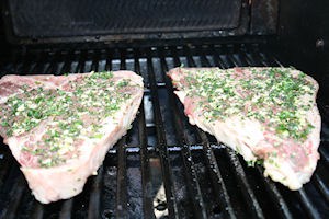 Place the steaks on the grill.